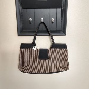The Sak black and tan pin striped purse